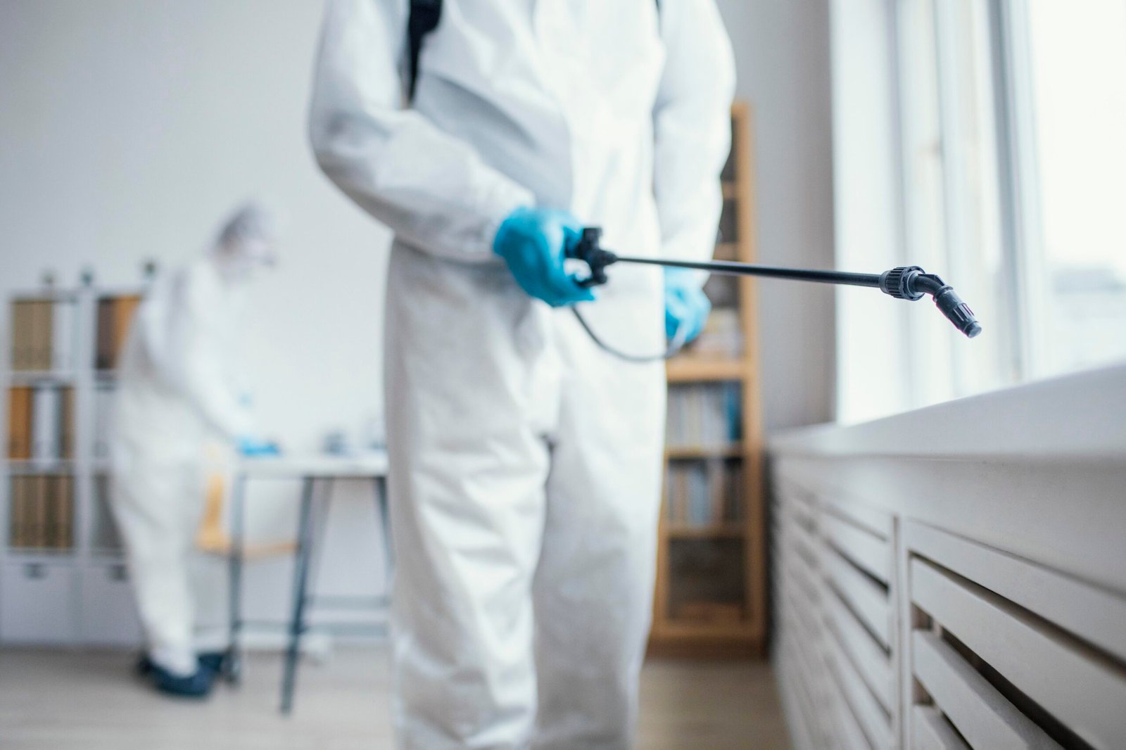 people-disinfecting-biohazard-area